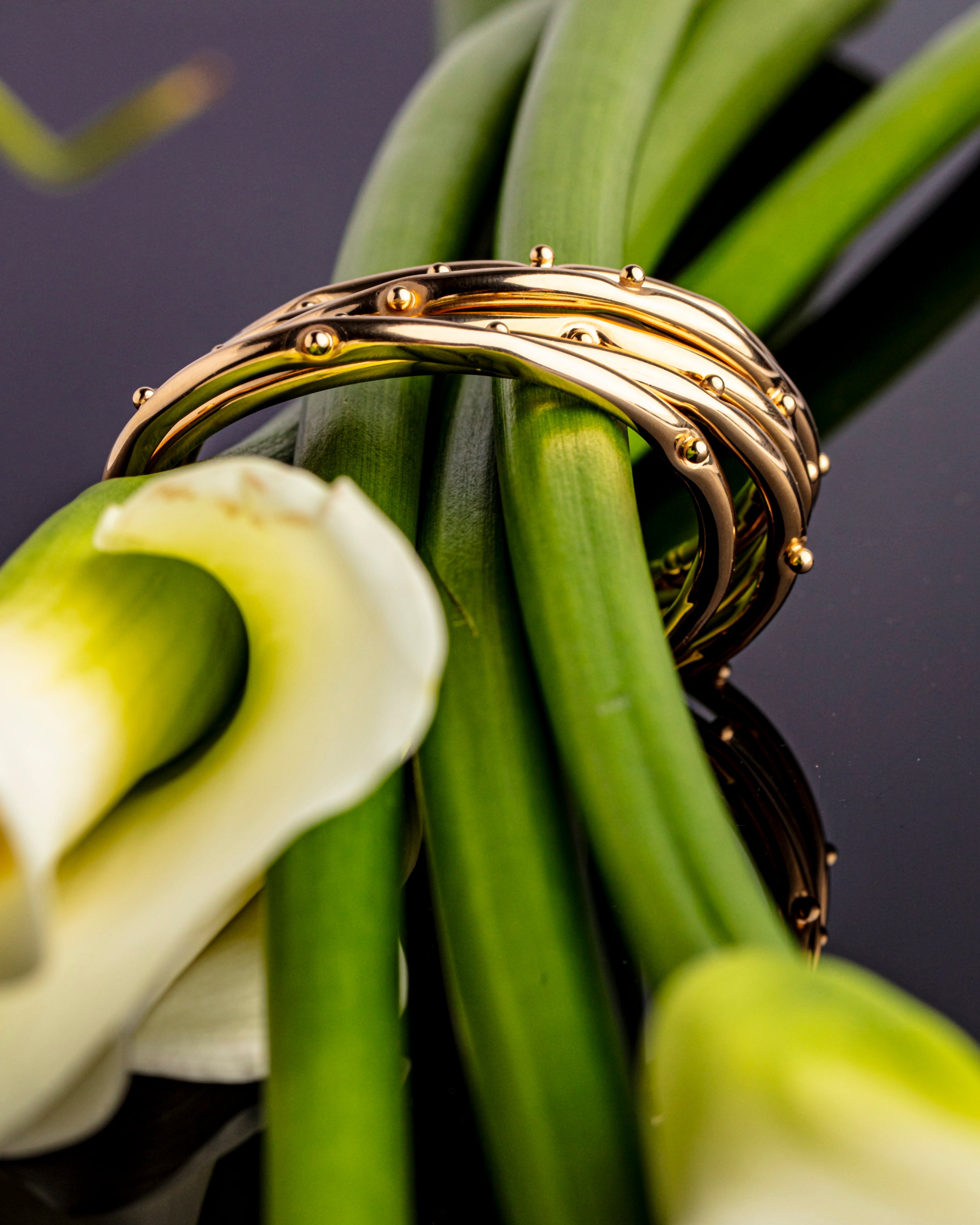 Gold plated bracelet with clean structured design and polished finish