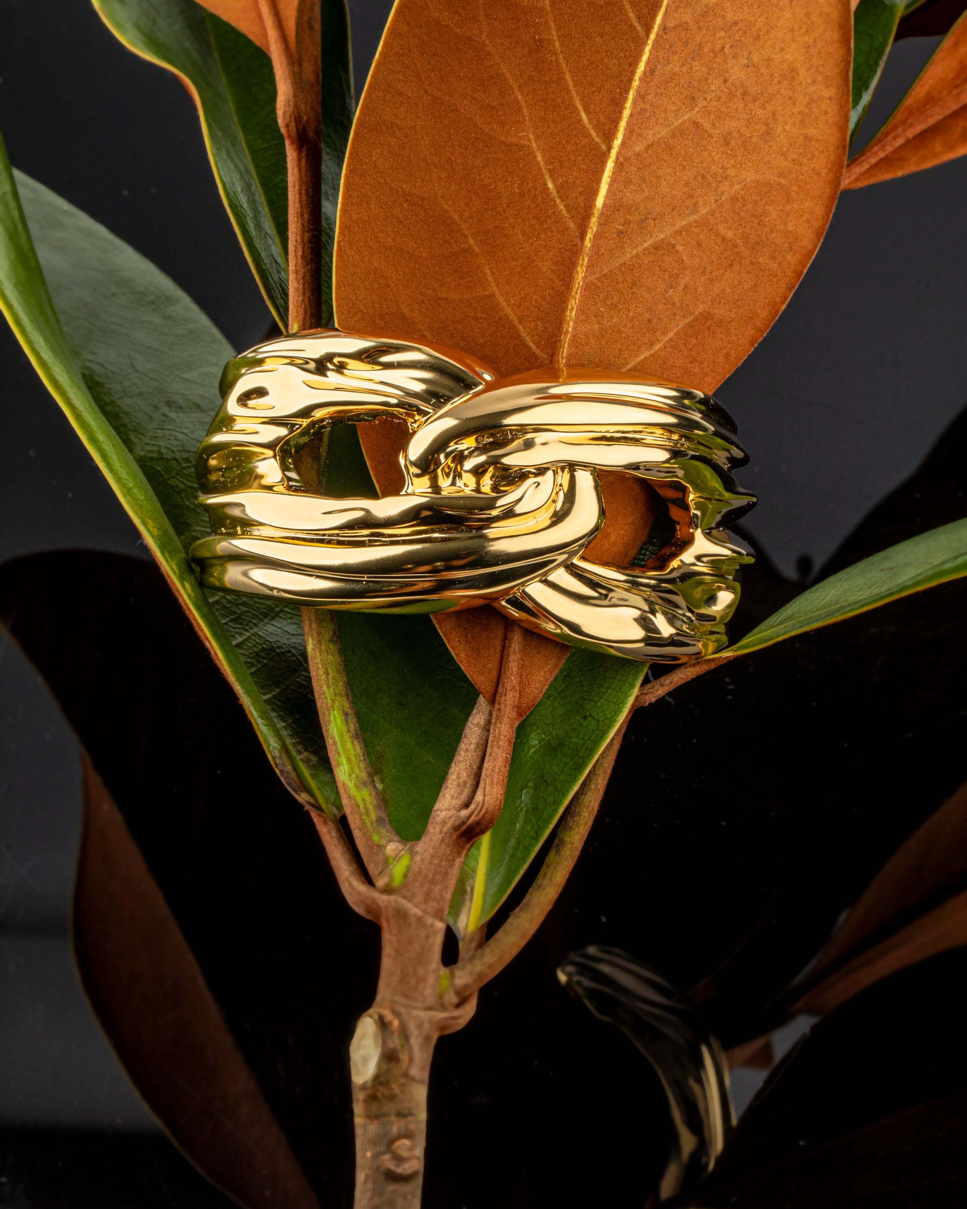 Gold plated structured bracelet with smooth polished surface and sleek design