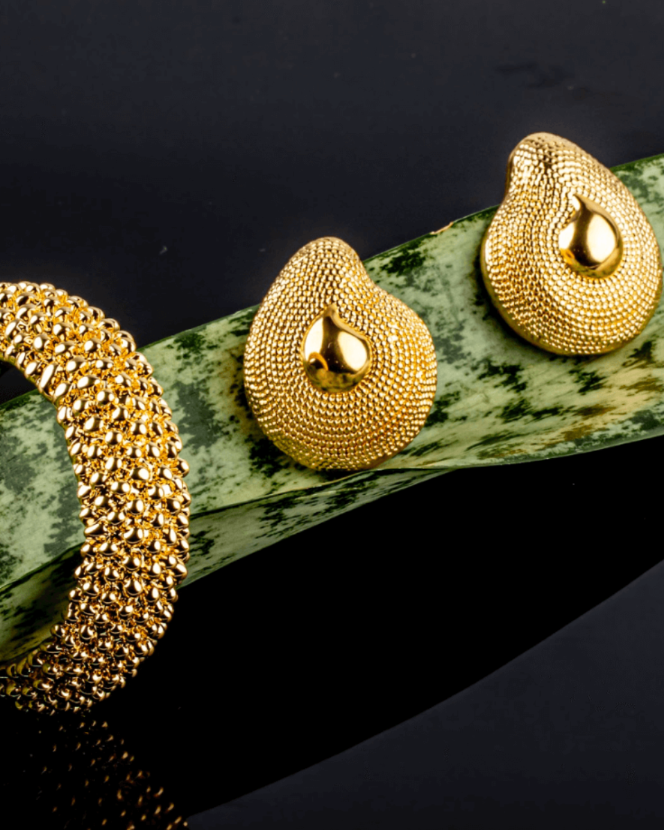 Gold plated textured dome earrings with rounded sculptural shape and asymmetric design, 40mm by 33mm