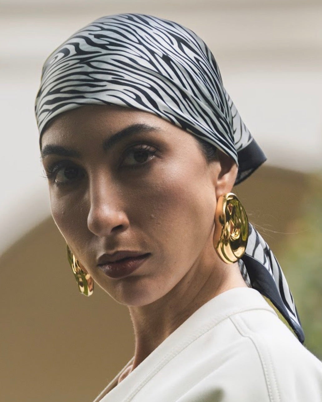 model wearing Clarice Maxi Abstract Oval Earrings