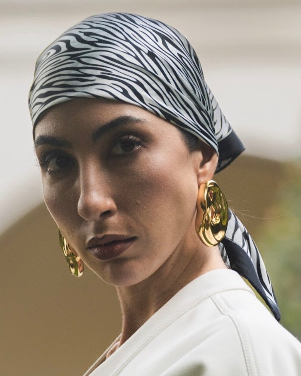 model wearing Clarice Maxi Abstract Oval Earrings
