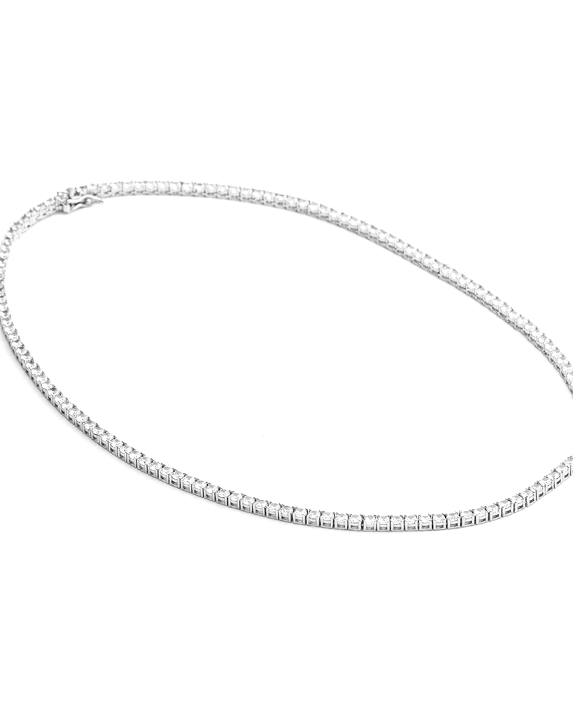 Tennis necklace and bracelet set with cubic zirconia stones available in gold plated and rhodium finishes