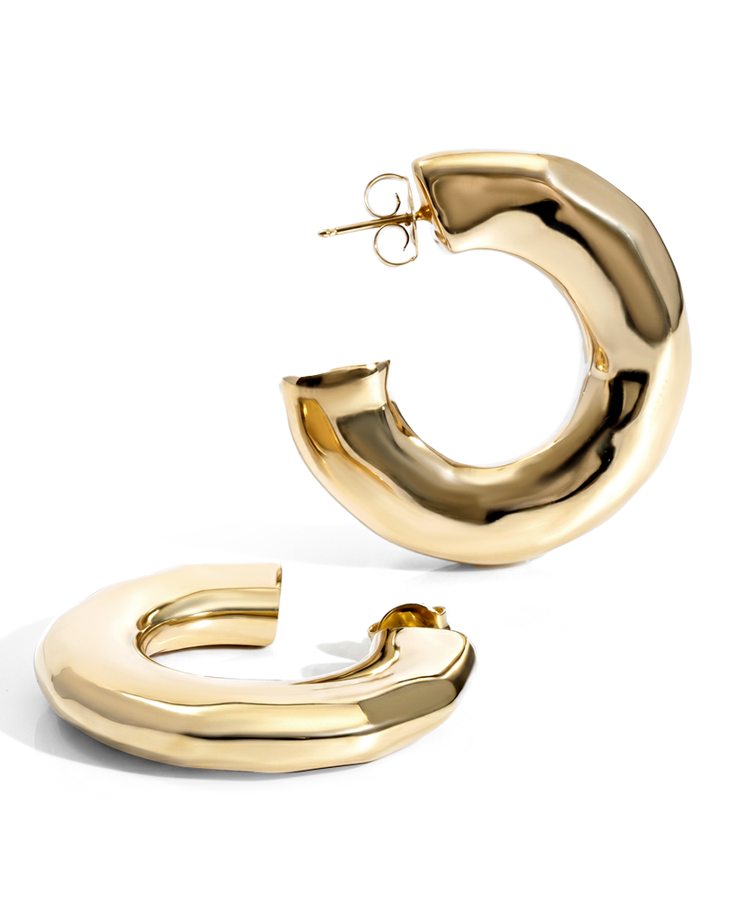 Hammered open hoop earrings available in gold plated and rhodium plated finishes with sculptural texture