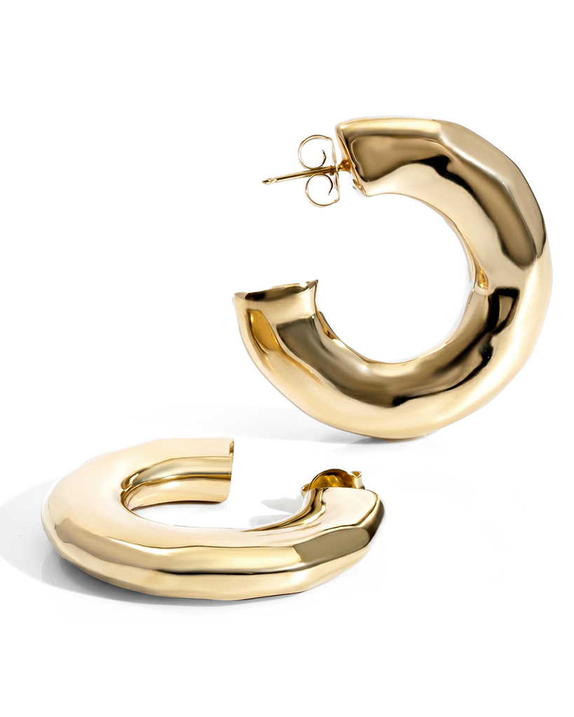 Hammered open hoop earrings available in gold plated and rhodium plated finishes with sculptural texture