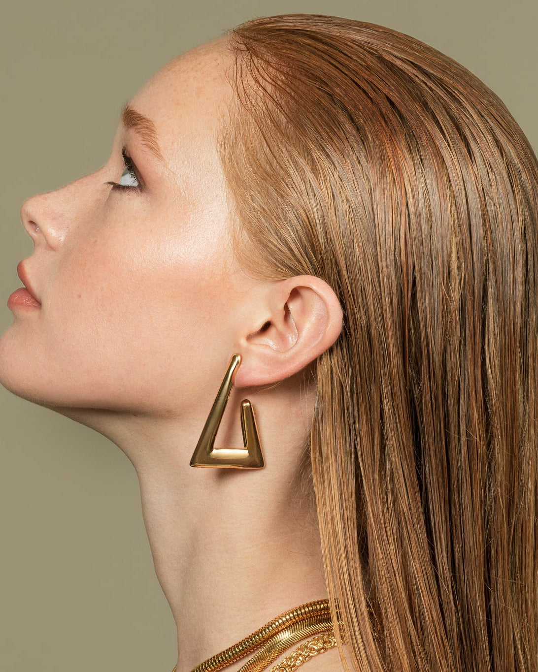 Geometric gold and rhodium plated triangular earrings with open-frame design and high-polish finish, 34mm by 50mm size