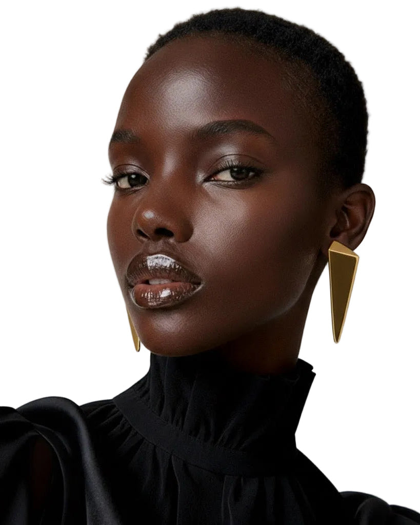 Gold plated elongated drop earrings with tapered sculptural design and polished finish, 60mm length