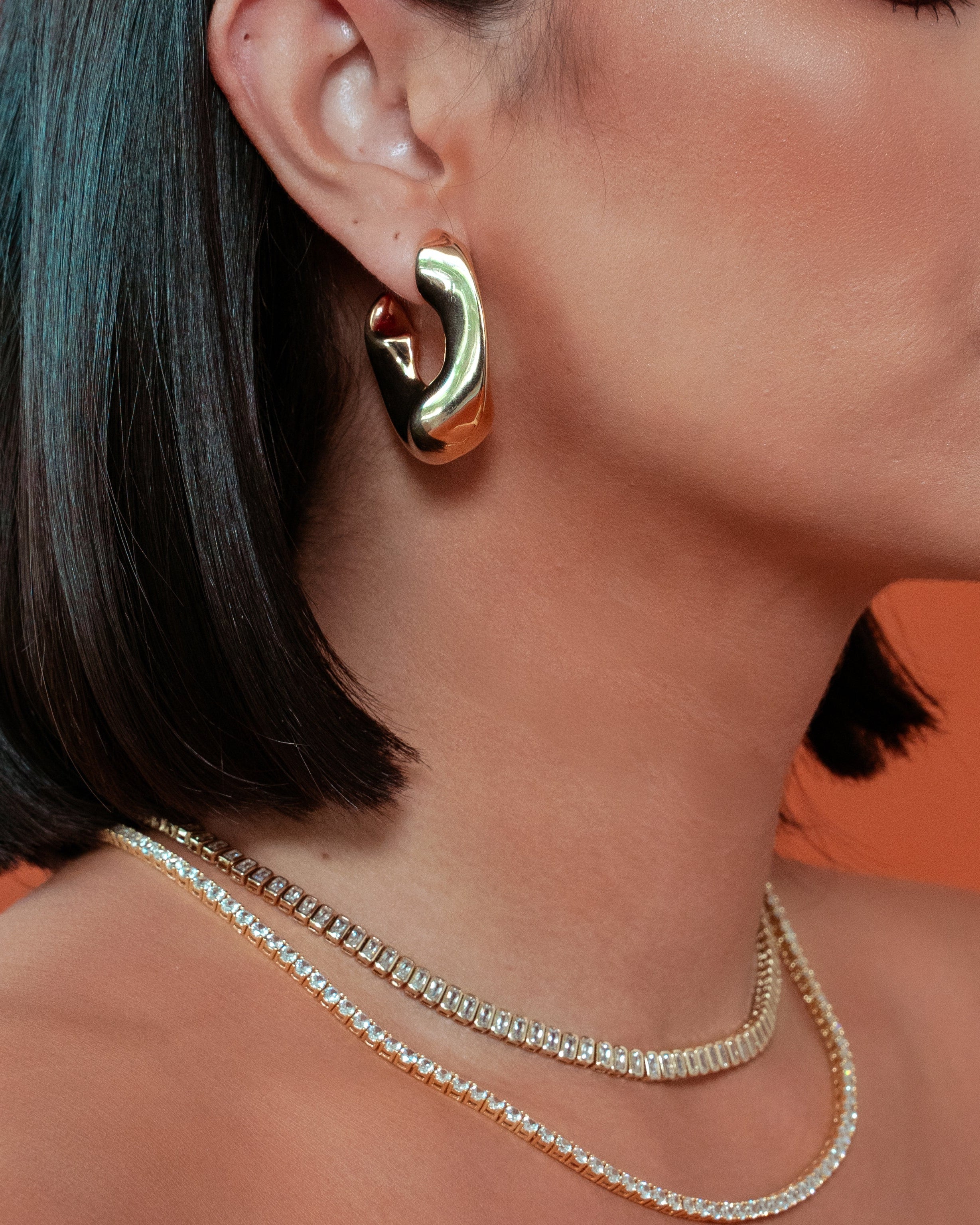 model wearing Ana Gold Hoops