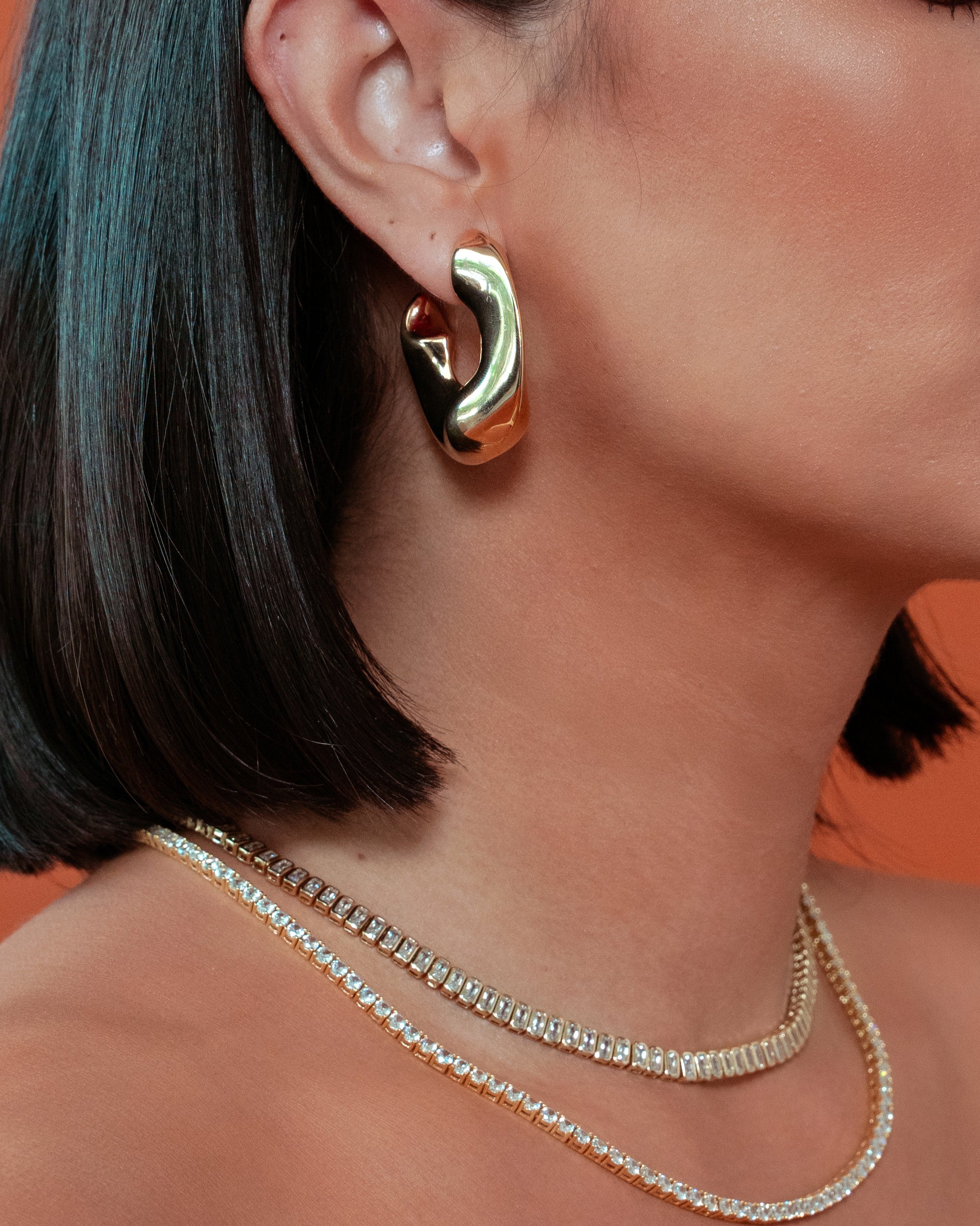 model wearing Ana Gold Hoops