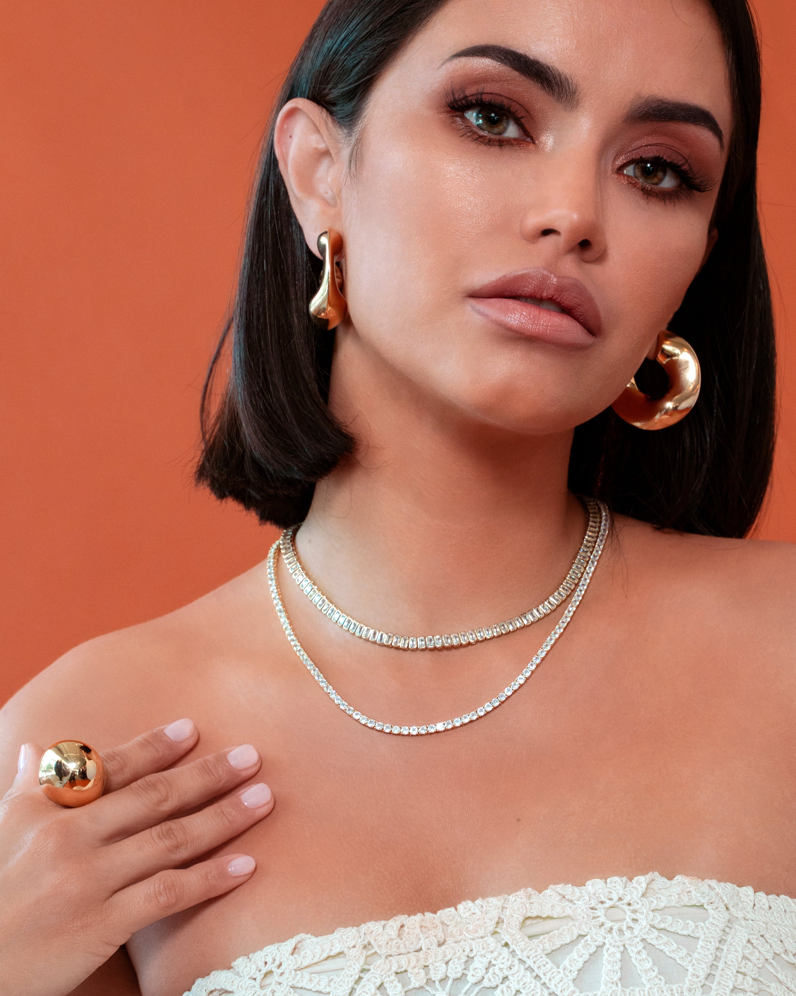 Sculptural statement ring in gold dome style, crafted with shiny 18K gold plating for modern elegance.