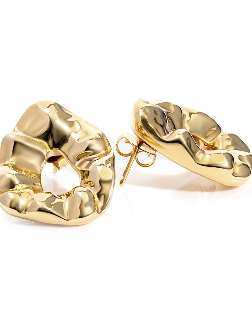 Sculptural hammered earrings available in gold plated and rhodium plated finishes with organic texture