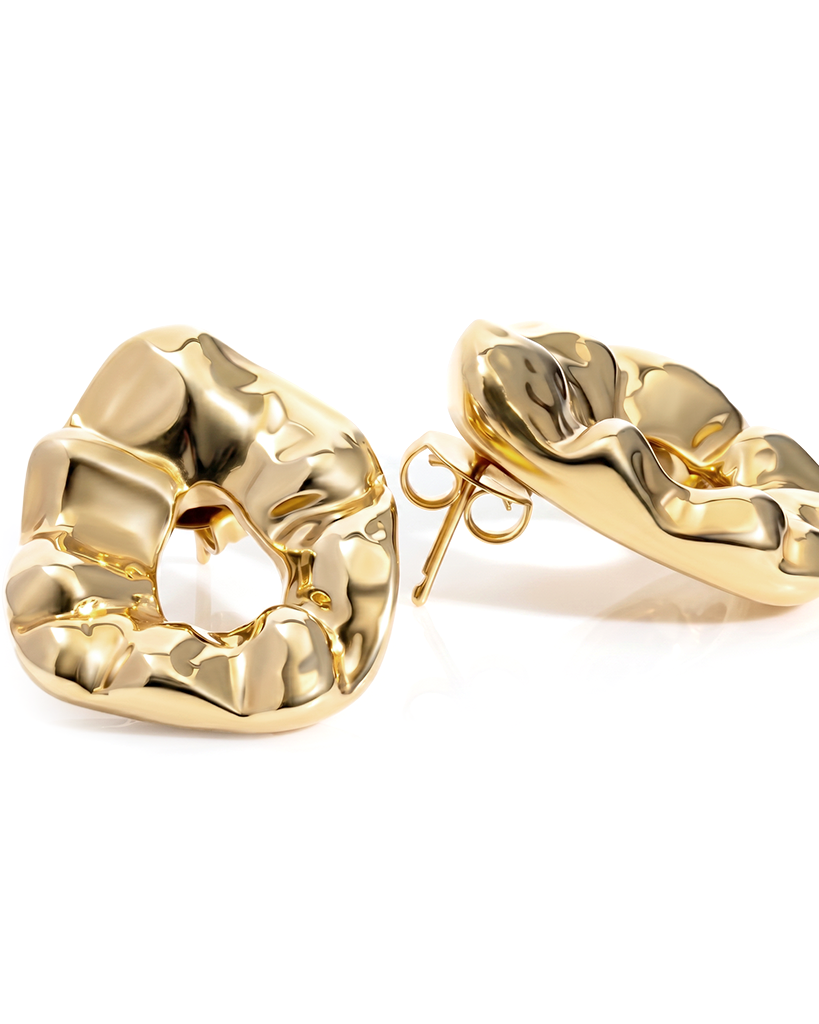 Sculptural hammered earrings available in gold plated and rhodium plated finishes with organic texture