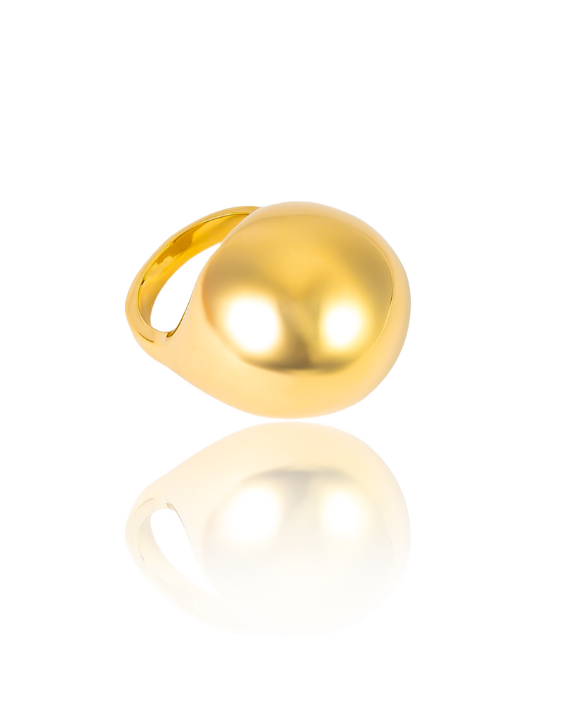 Gold plated oversized dome ring with smooth polished surface and sculptural design