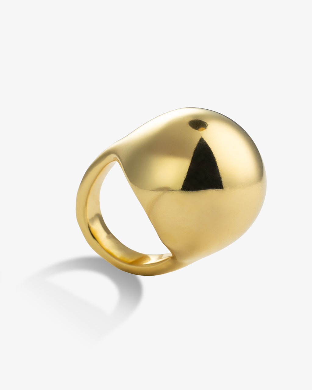 Chunky gold dome statement ring angled side view