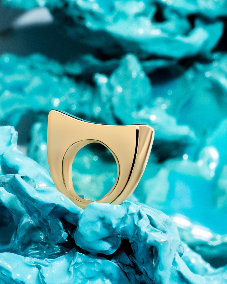 Gold sculptural bracelet with polished curved design and refined silhouette