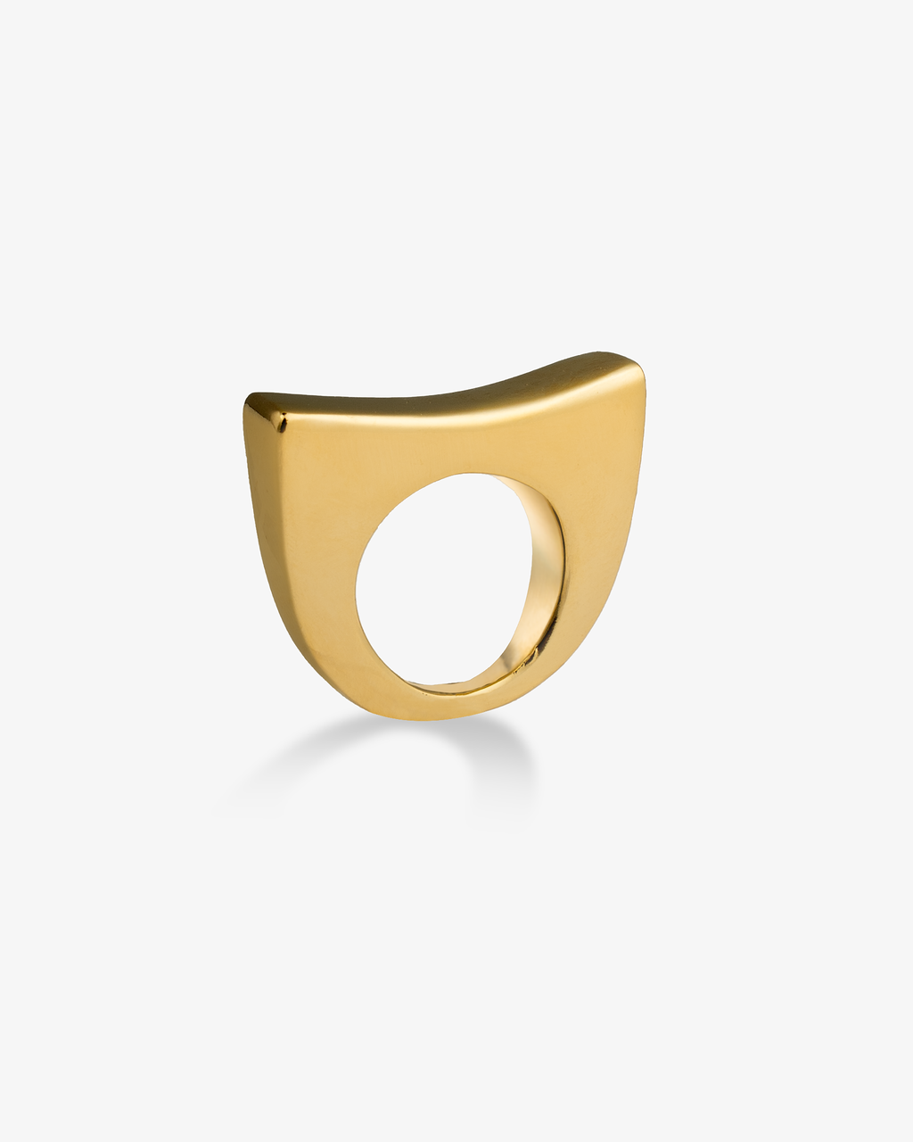 Wide curved gold statement ring angled front view