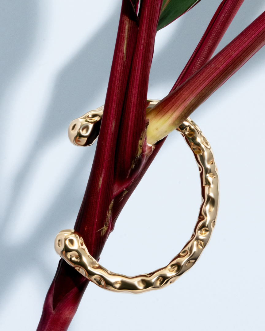 Gold molten textured cuff bracelet with organic sculptural design and 8mm thickness