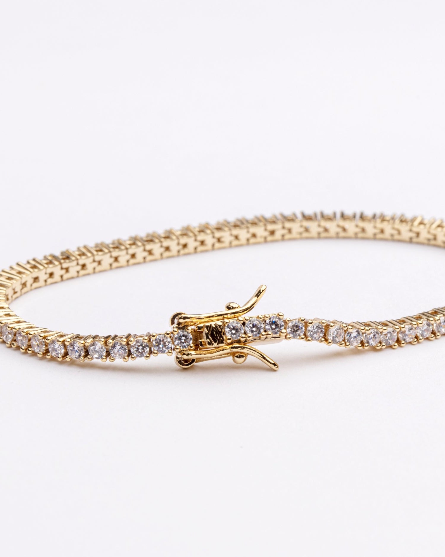 Tennis necklace and bracelet set with cubic zirconia stones available in gold plated and rhodium finishes