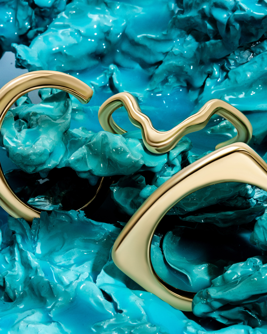 Gold sculptural bracelet with organic curved design and polished finish