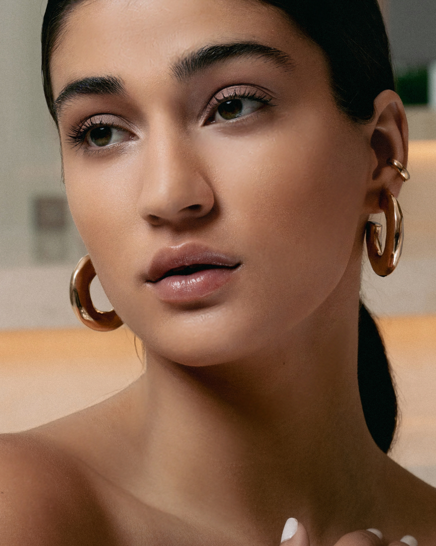 Hammered open hoop earrings available in gold plated and rhodium plated finishes with sculptural texture