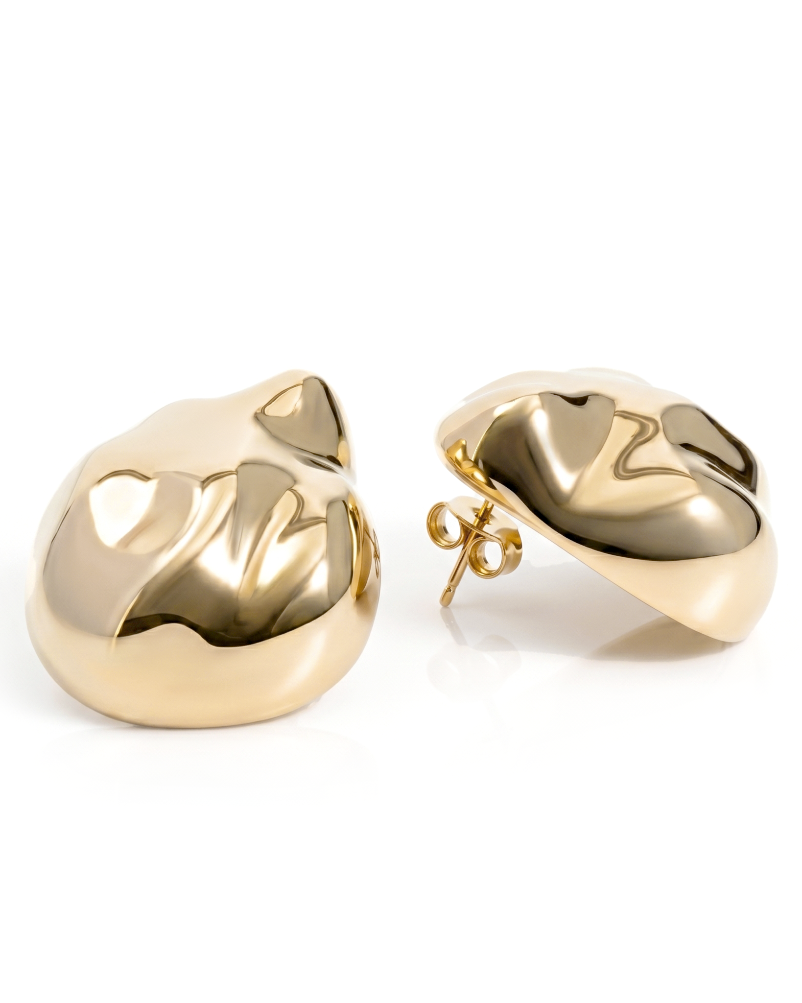 Dome earrings available in gold plated and rhodium plated finishes with dented sculptural texture