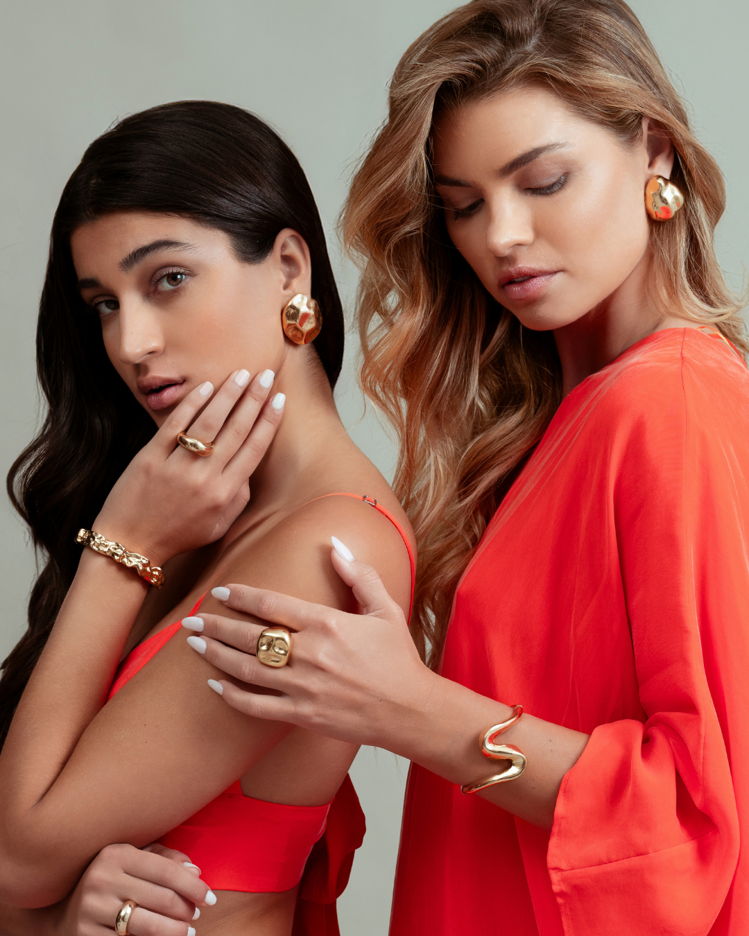 Dome earrings available in gold plated and rhodium plated finishes with dented sculptural texture