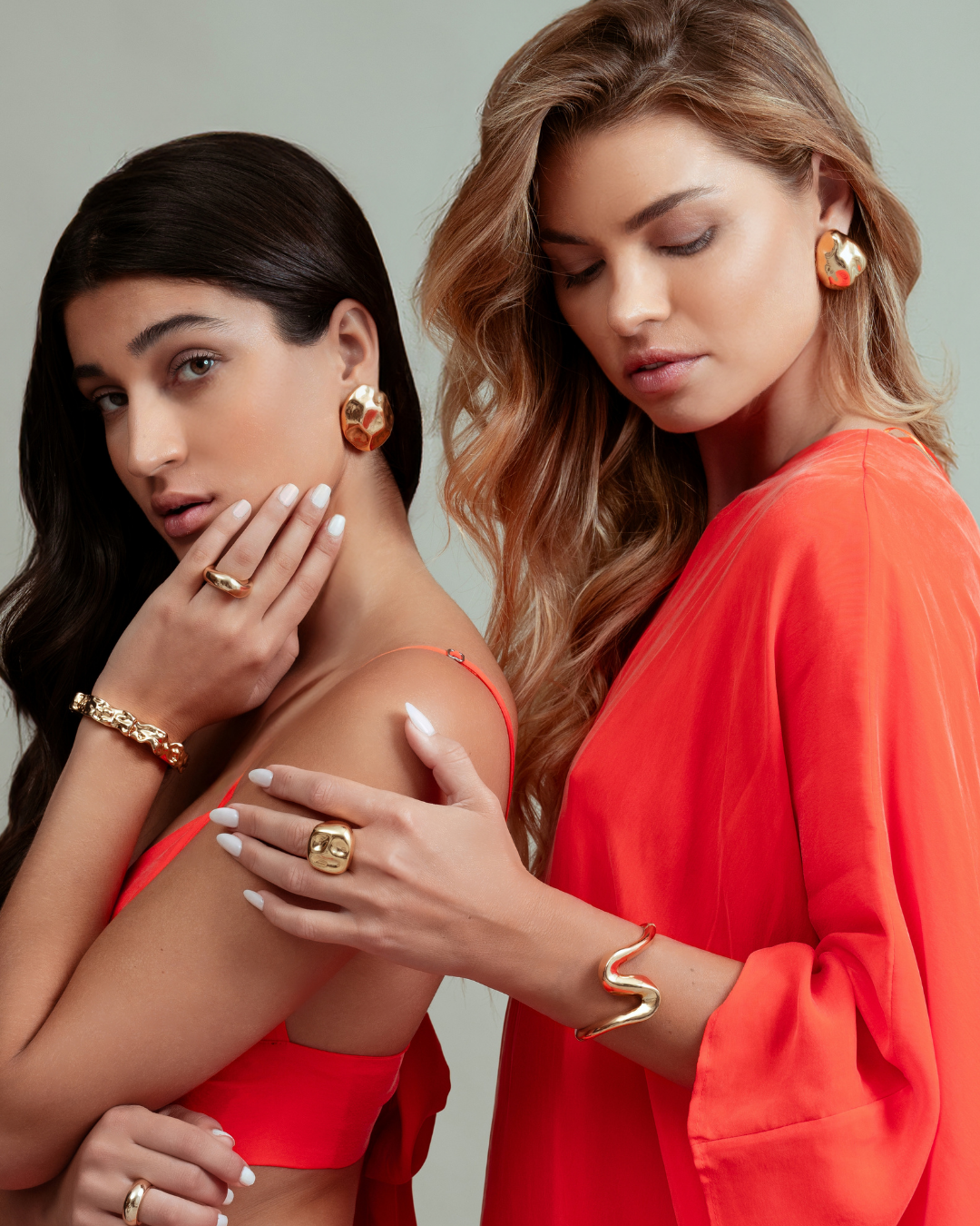Dome earrings available in gold plated and rhodium plated finishes with dented sculptural texture