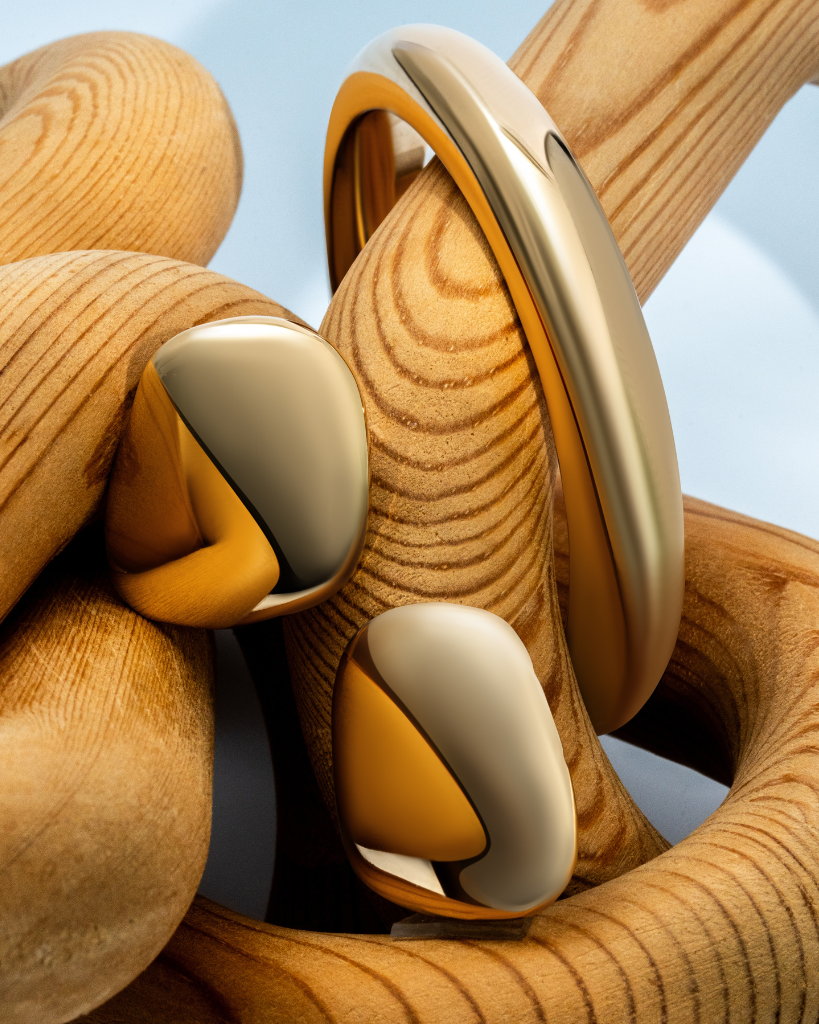 Sculptural cuff bracelet available in gold plated and rhodium plated finishes with bold circular design