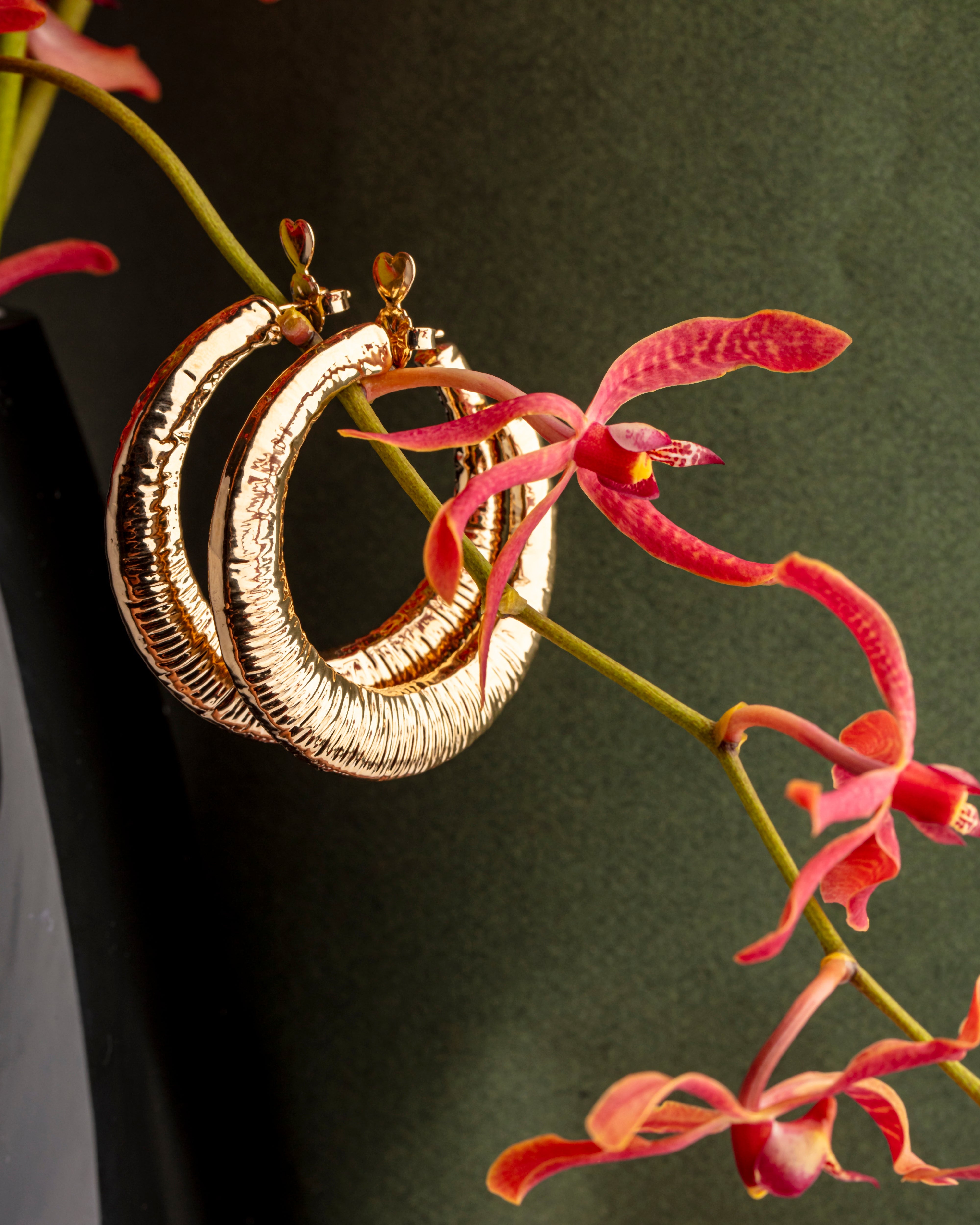 Gold plated open hoop earrings with subtle textured surface and lightweight design