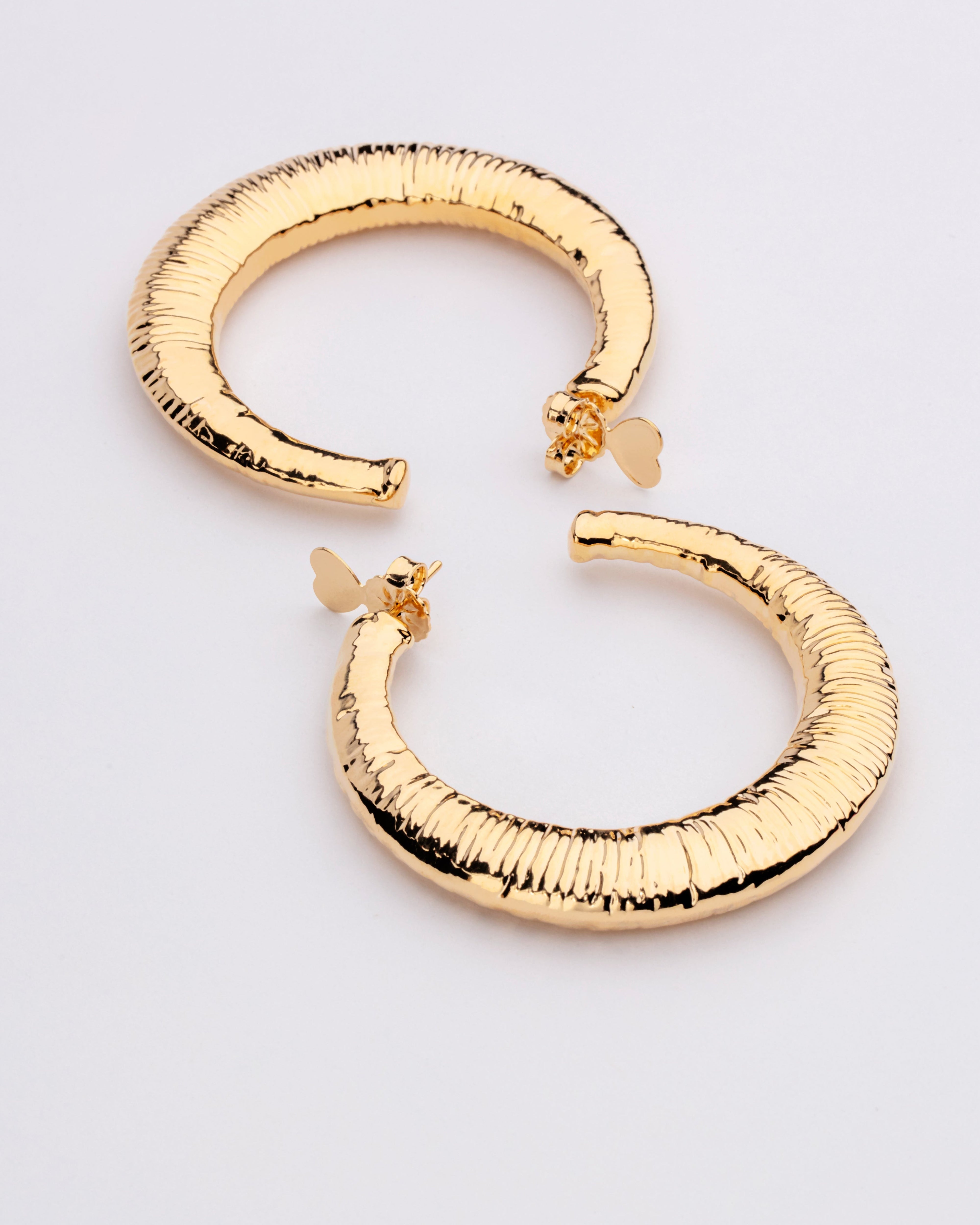 Gold plated open hoop earrings with subtle textured surface and lightweight design