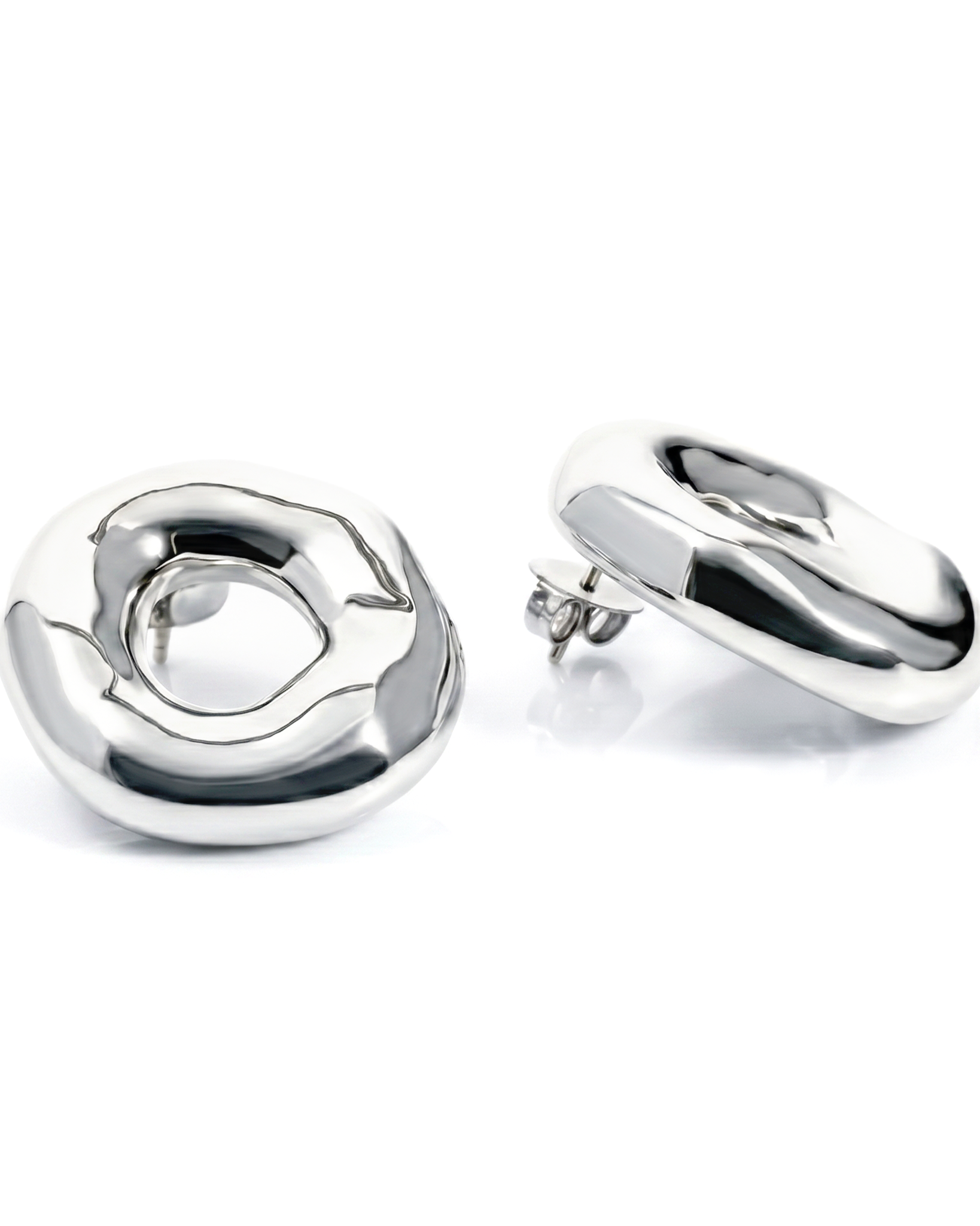 Melted circle earrings available in gold plated and rhodium plated finishes with sculptural curved design