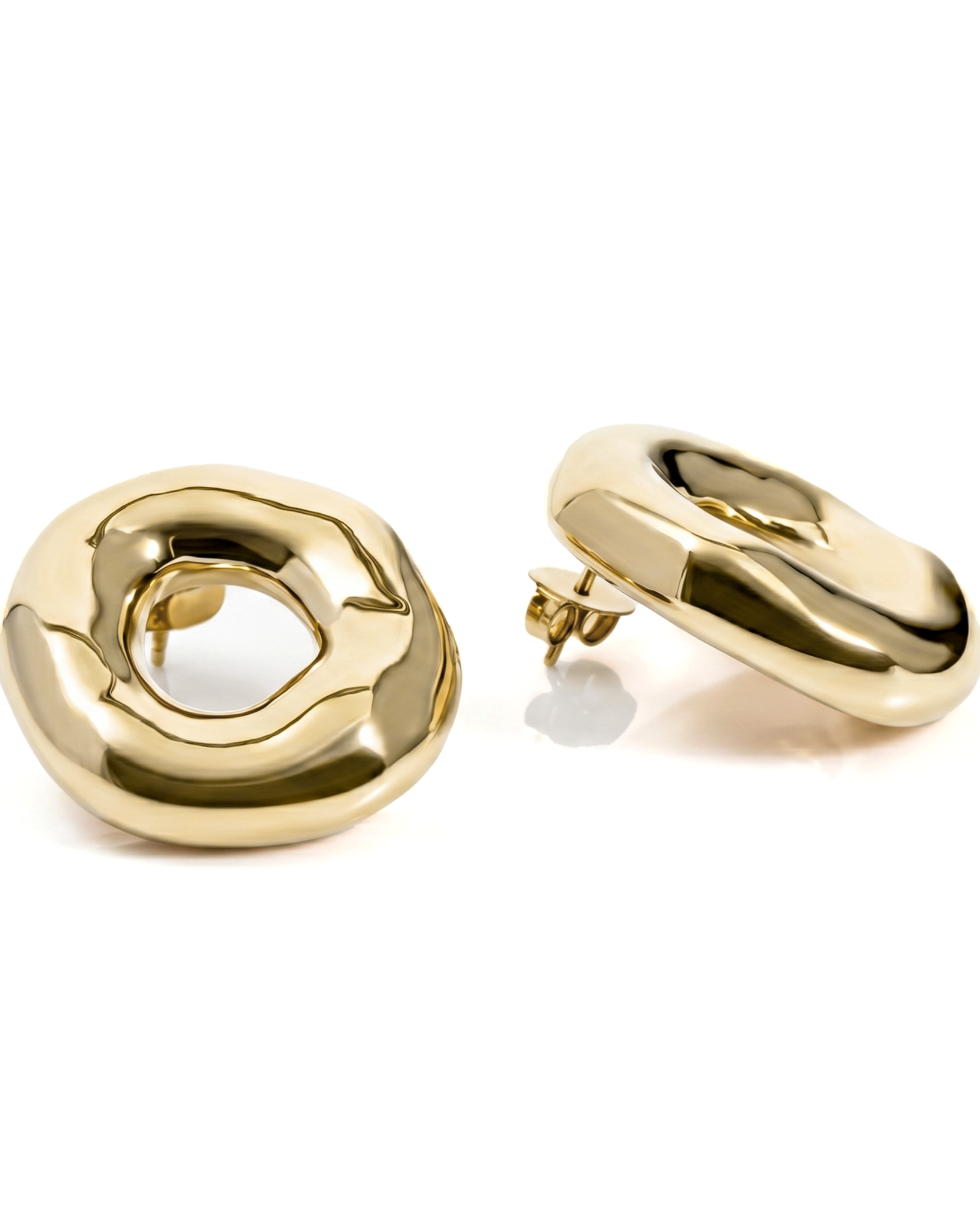 Melted circle earrings available in gold plated and rhodium plated finishes with sculptural curved design