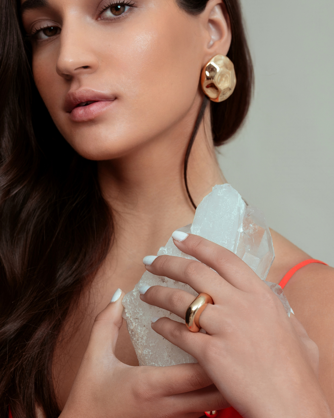 Gold dome earrings with organic sculptural shape and polished curved surface