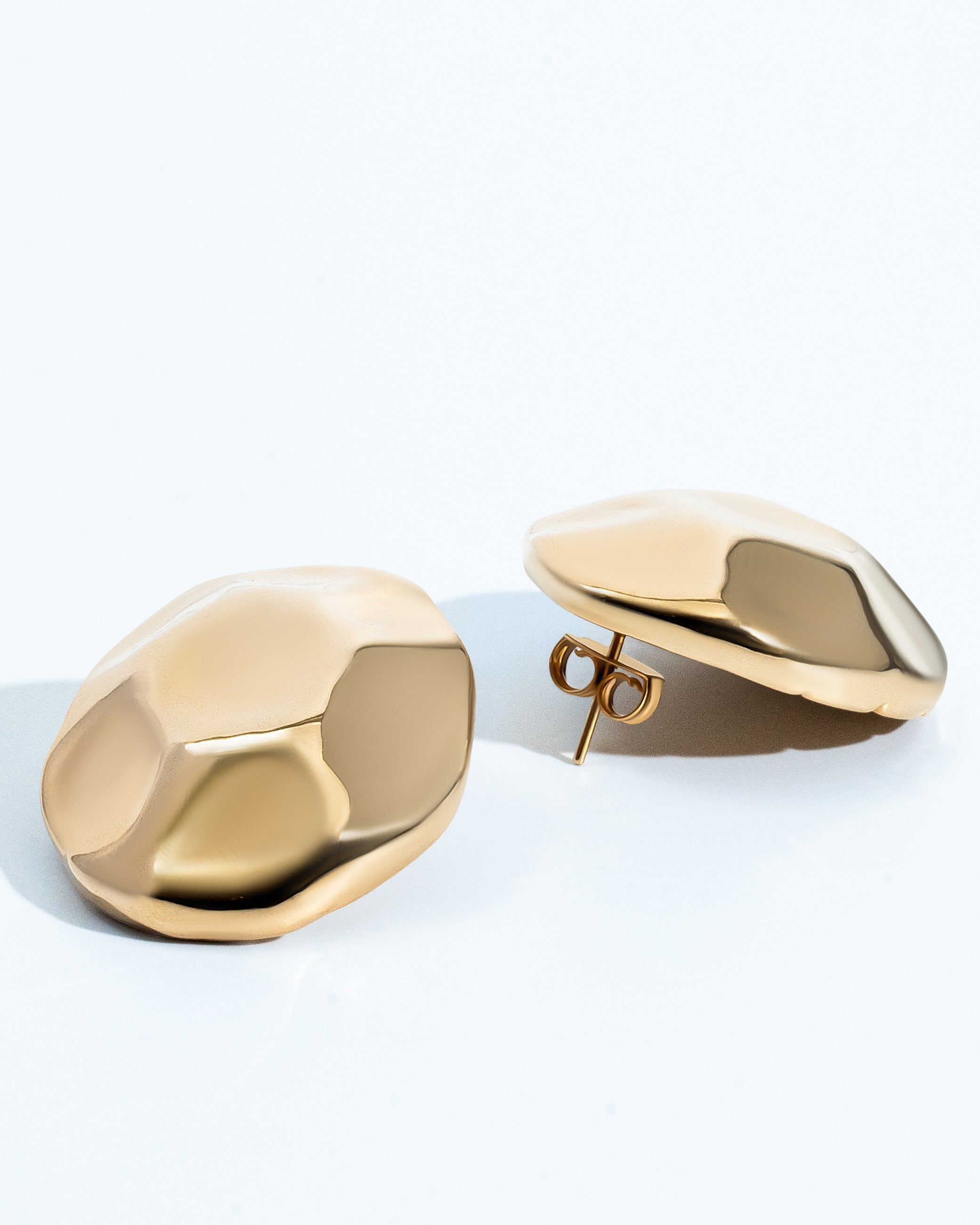 Gold dome earrings with organic sculptural shape and polished curved surface