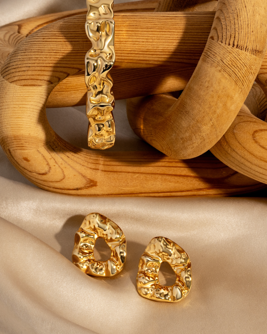 Sculptural hammered earrings available in gold plated and rhodium plated finishes with organic texture