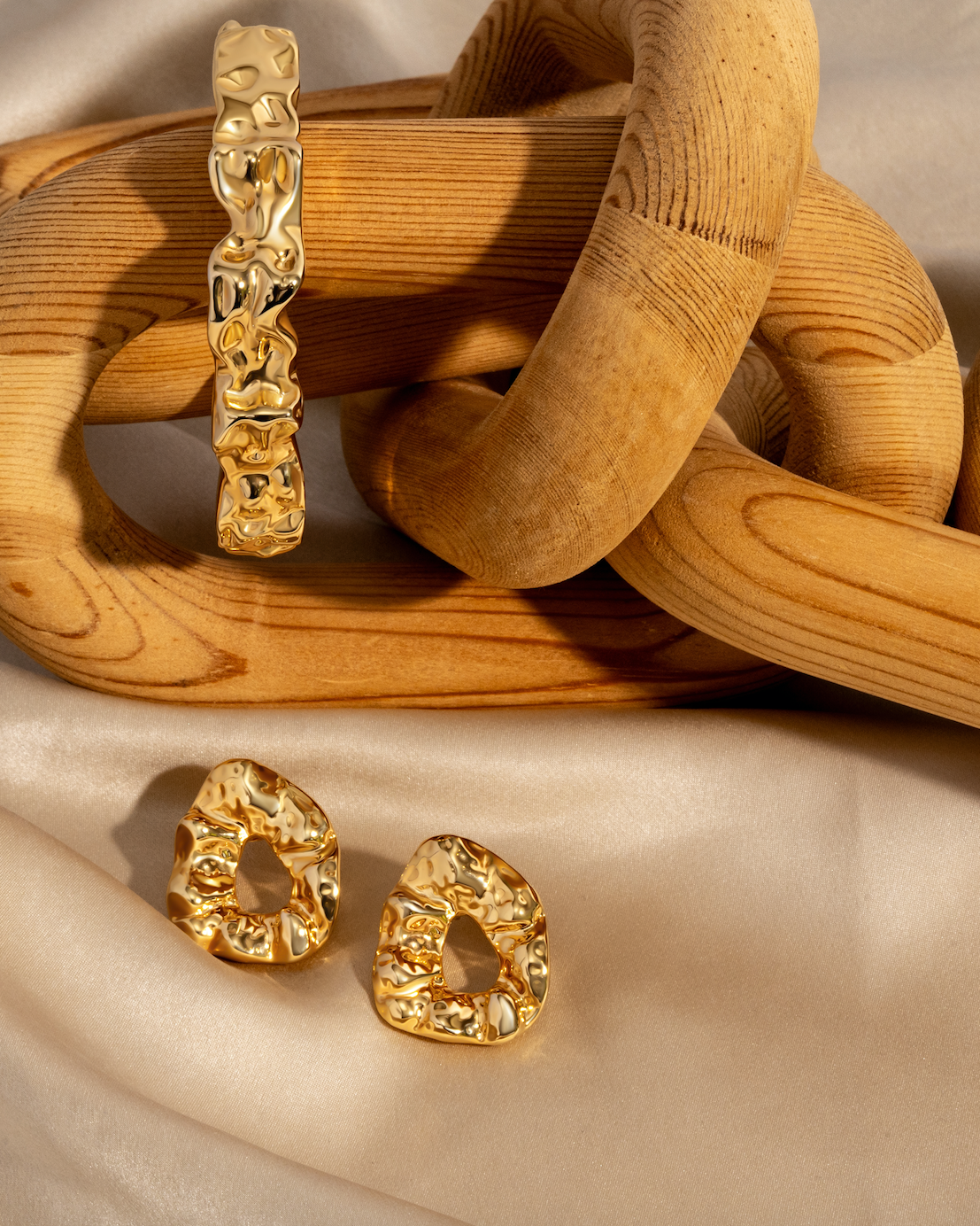 Sculptural hammered earrings available in gold plated and rhodium plated finishes with organic texture