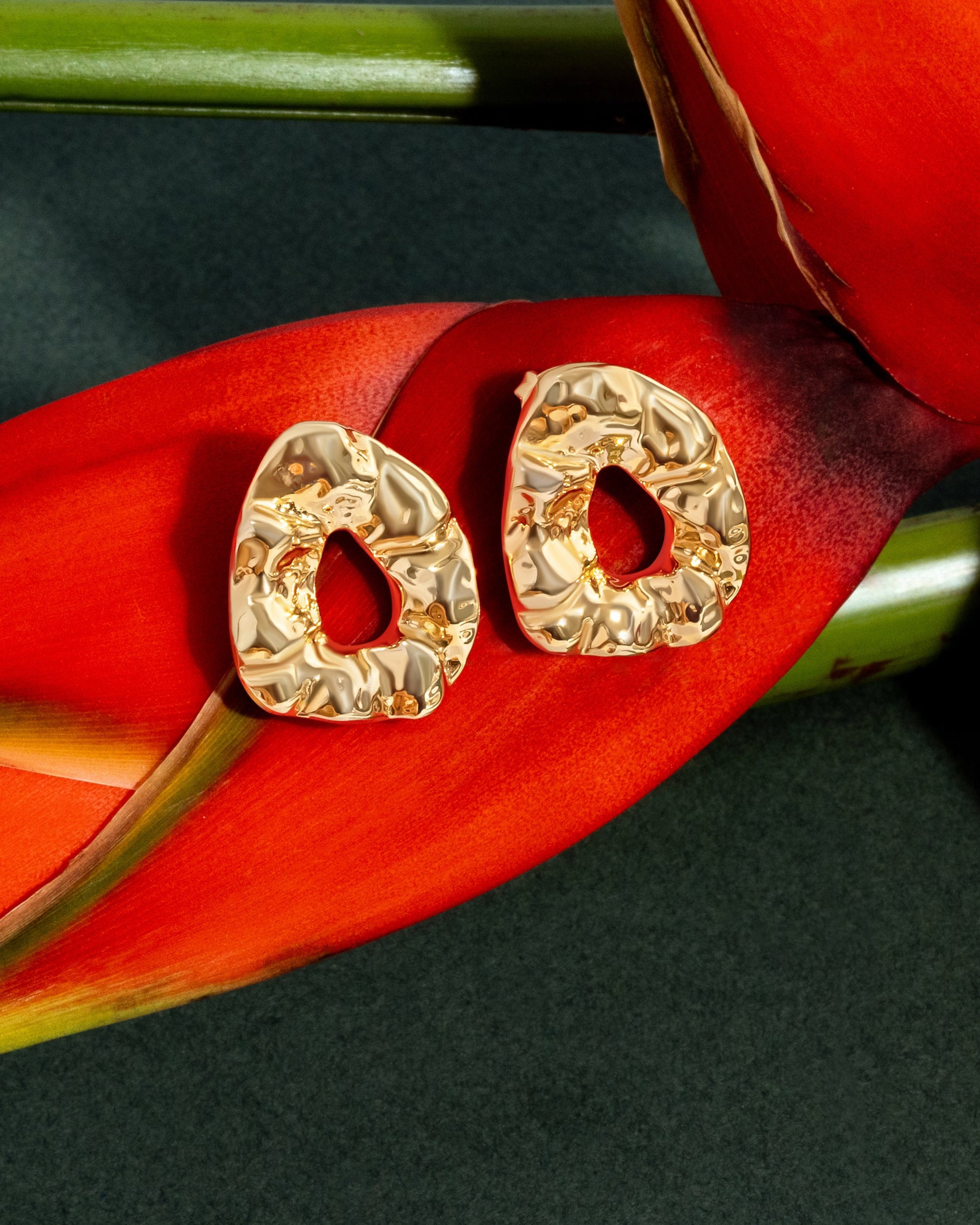 Sculptural hammered earrings available in gold plated and rhodium plated finishes with organic texture