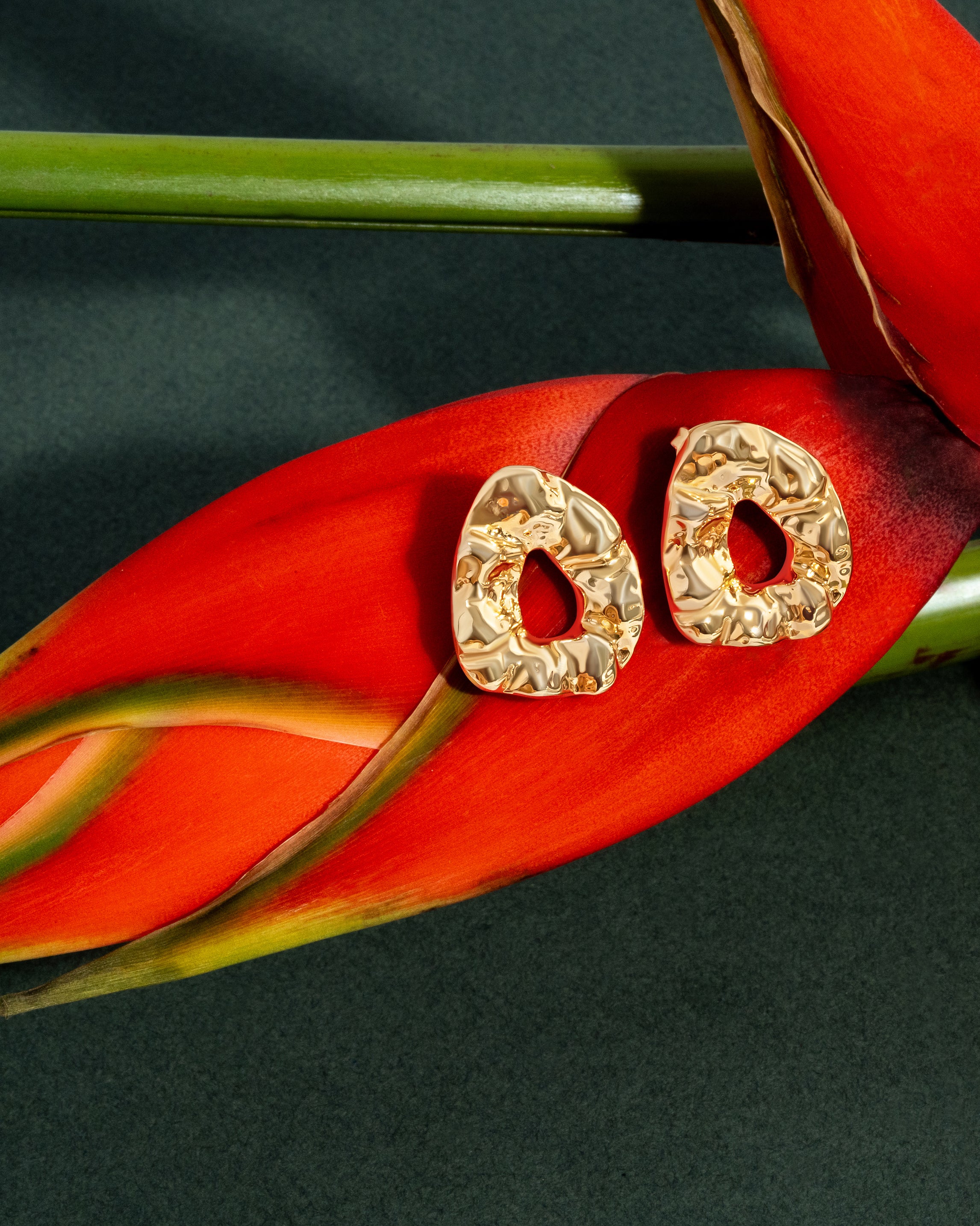 Sculptural hammered earrings available in gold plated and rhodium plated finishes with organic texture