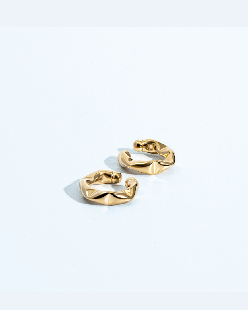 Gold twisted ear cuff with sculptural design, no piercing required