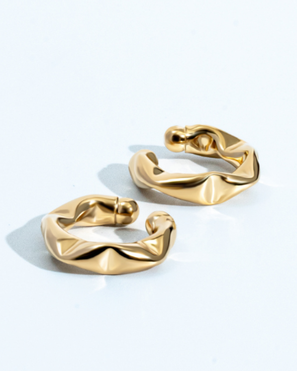 Gold twisted ear cuff with sculptural design, no piercing required