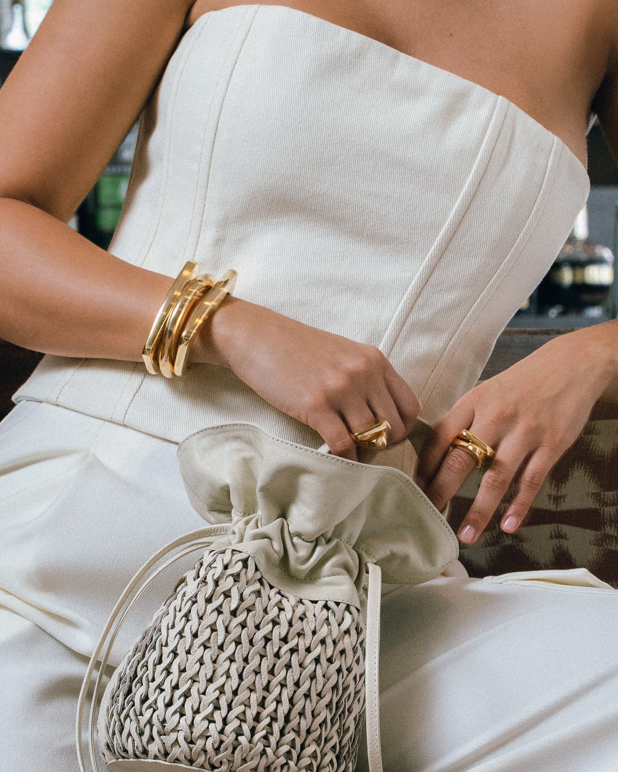 Geometric open-frame earrings available in gold plated and rhodium plated finishes with architectural design