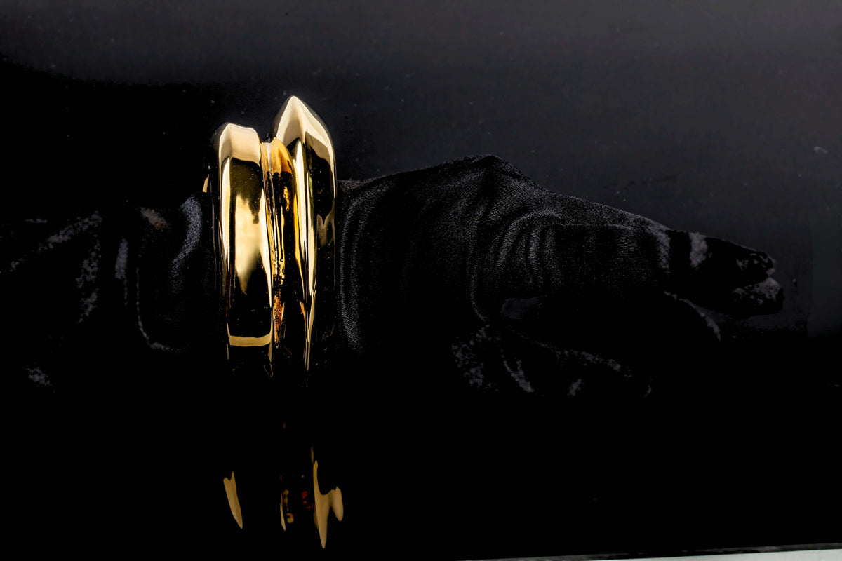 Gold plated wide cuff bracelet with open structured design and smooth polished surface, 40mm