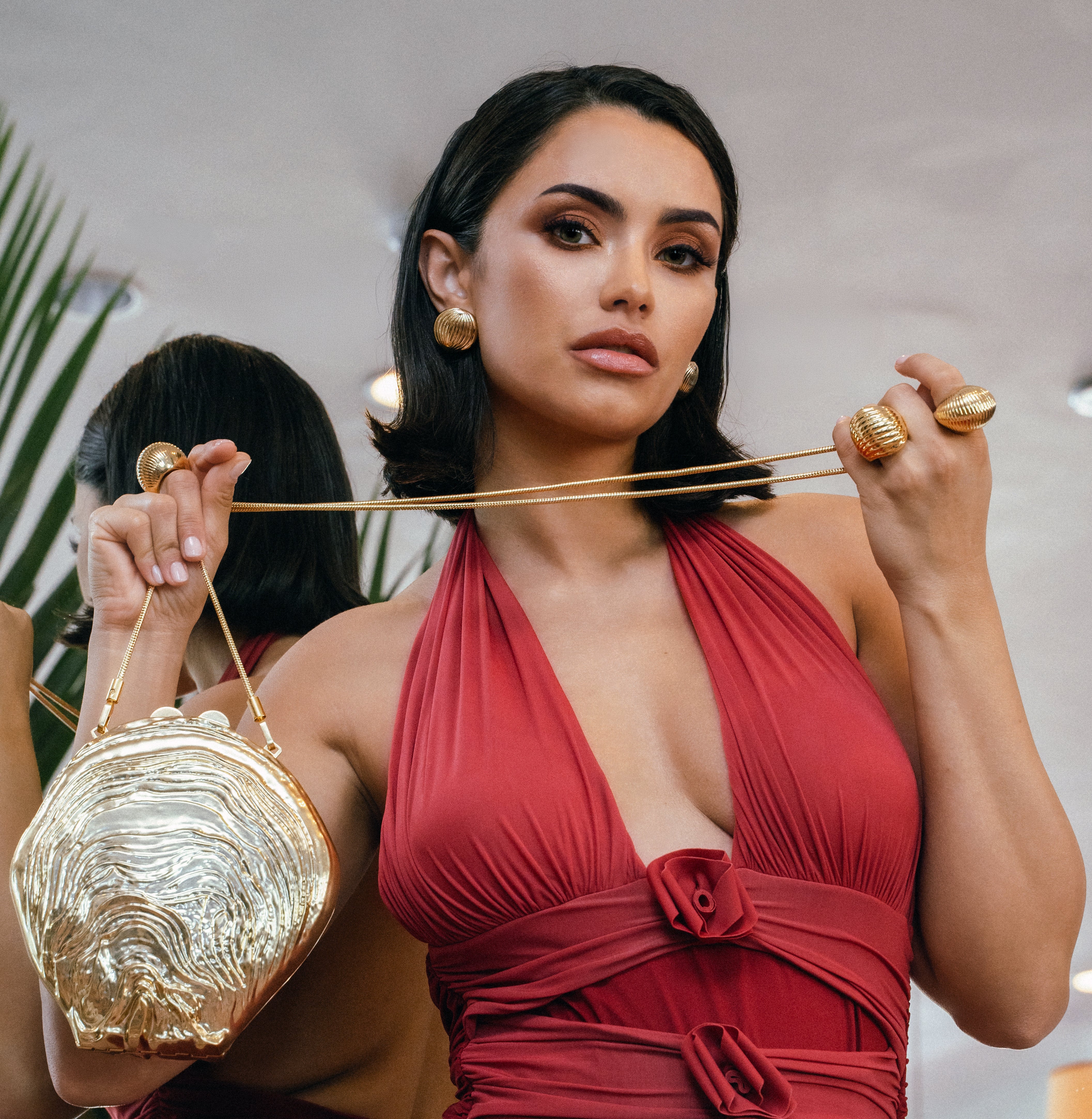 Model wearing Adriana Gold Earrings