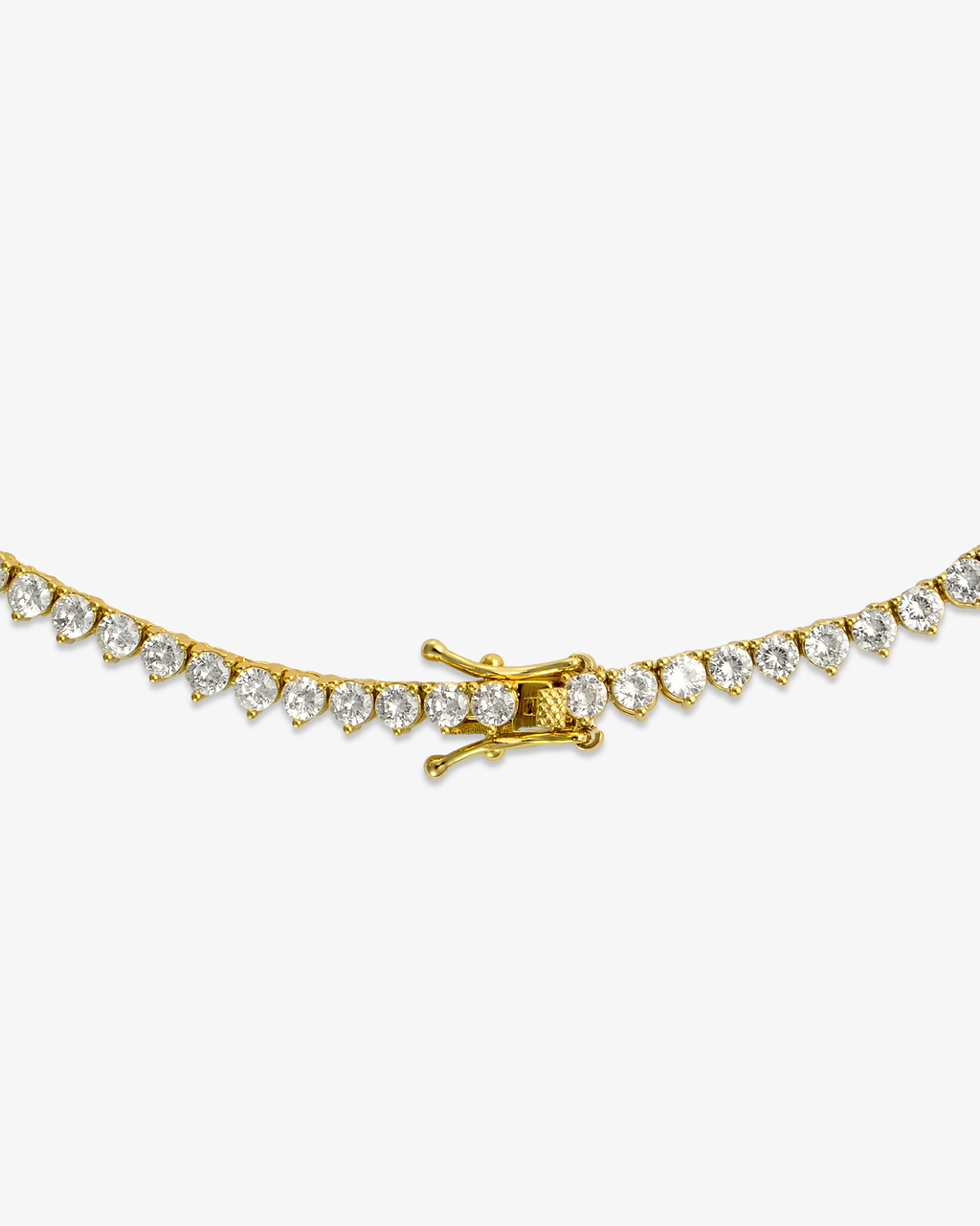 Gold three-prong tennis necklace with simulated diamond stones, alone close-up product shot of the clasp.