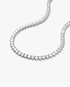 Silver round simulated diamond tennis necklace, alone product shot laid in a curved squiggle shape.