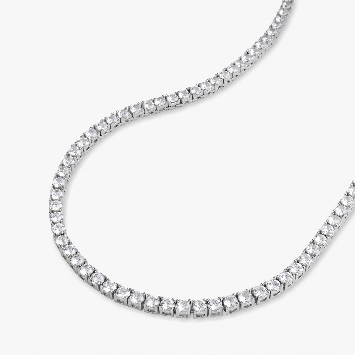 Silver round simulated diamond tennis necklace, alone product shot from a curved angle.