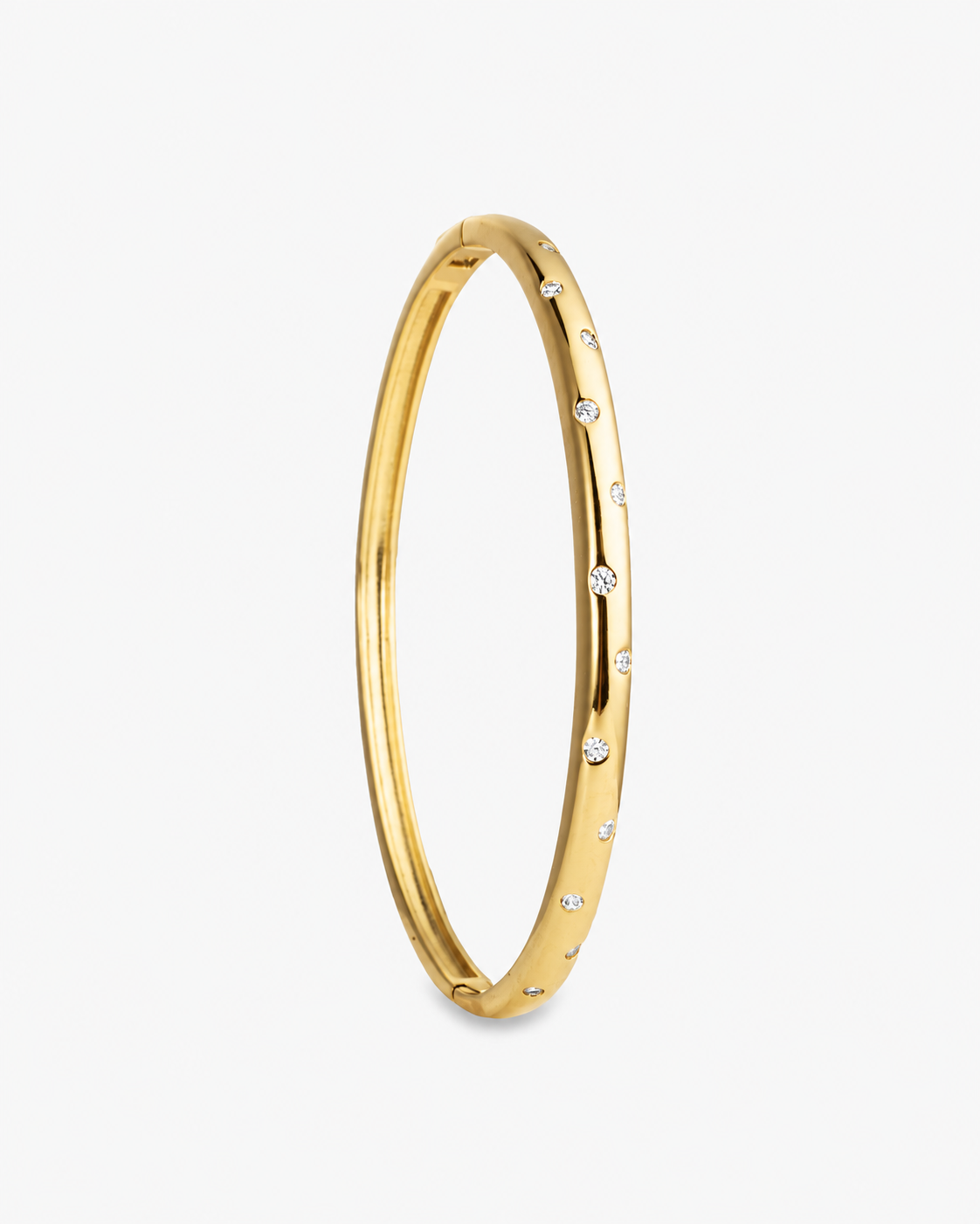 Gold slim textured bangle bracelet, alone product shot from a different angle.