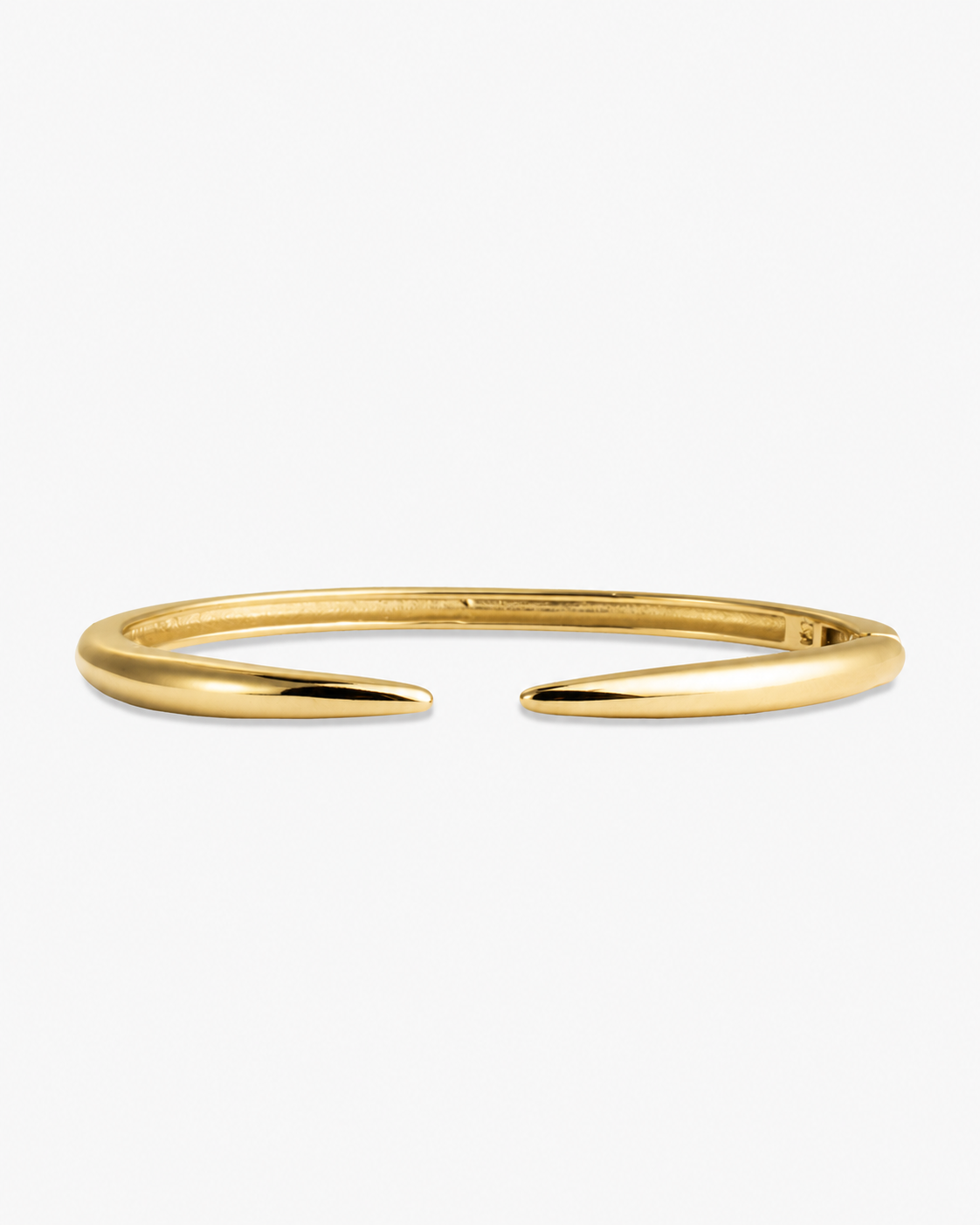 Gold slim open cuff bangle bracelet, alone product shot on a plain background.