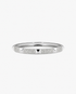 Silver textured bangle bracelet, alone product shot on a plain background.