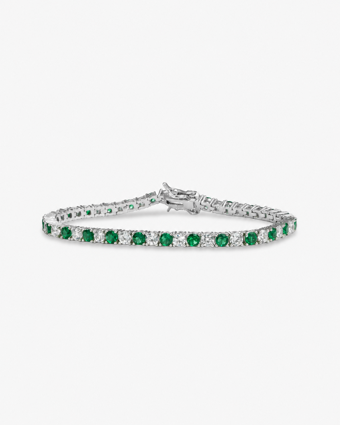 Silver tennis bracelet with green colored stone detailing, alone product shot on a plain background.