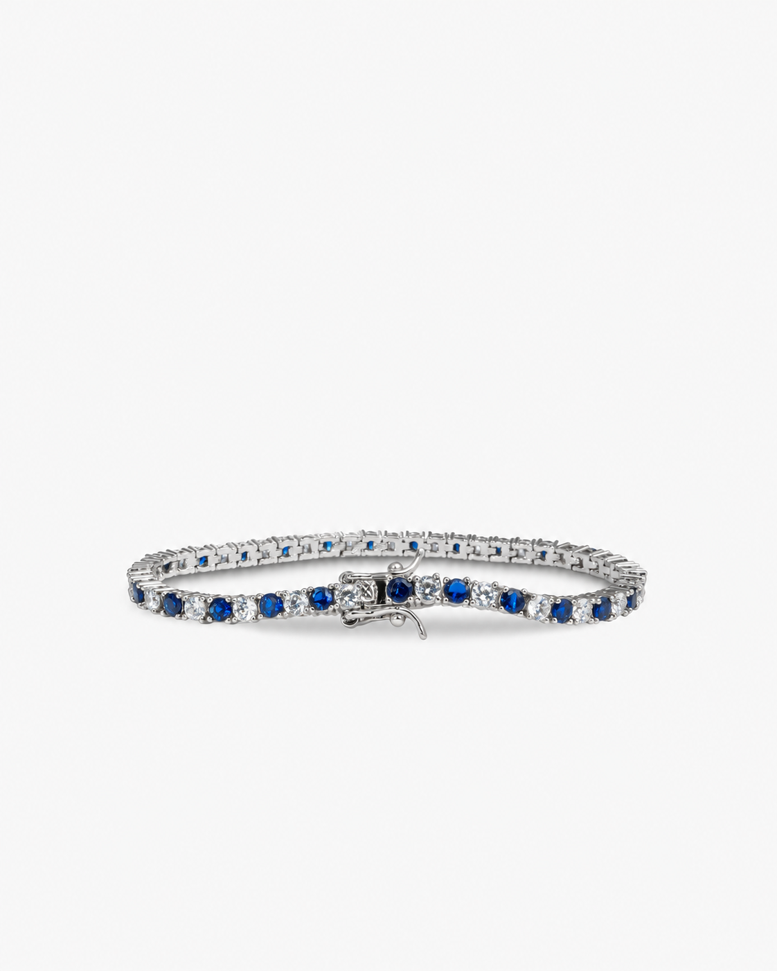 Silver tennis bracelet with blue colored stone detailing, alone product shot from a different angle.